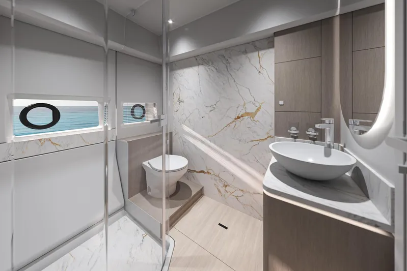  Yacht Photos Pics Luxurious bathroom in 2026 Beneteau Gran Turismo 50 yacht, featuring marble accents and modern fixtures.