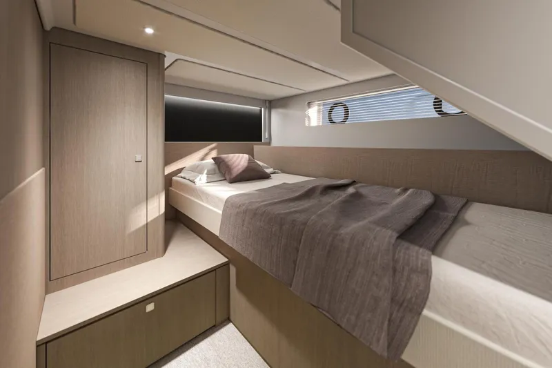  Yacht Photos Pics Luxurious cabin interior of 2026 Beneteau Gran Turismo 50 yacht, featuring modern design and cozy bedding.