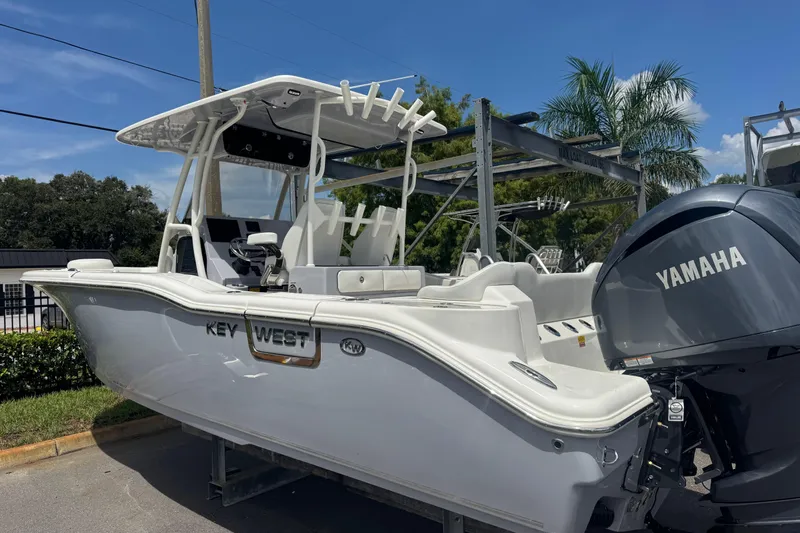  Yacht Photos Pics 2025 Key West 263 FS boat with Yamaha engine, parked outdoors under clear sky.
