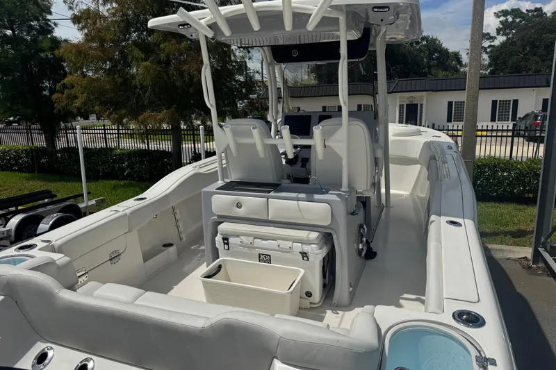  Yacht Photos Pics 2025 Key West 263 FS boat interior with seating, console, and storage compartments.