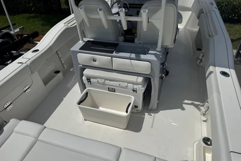  Yacht Photos Pics 2025 Key West 263 FS boat interior with seating and storage compartments.