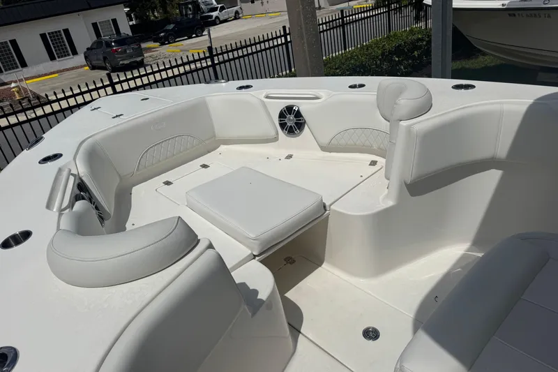  Yacht Photos Pics 2025 Key West 263 FS boat interior with white seating and speaker system.