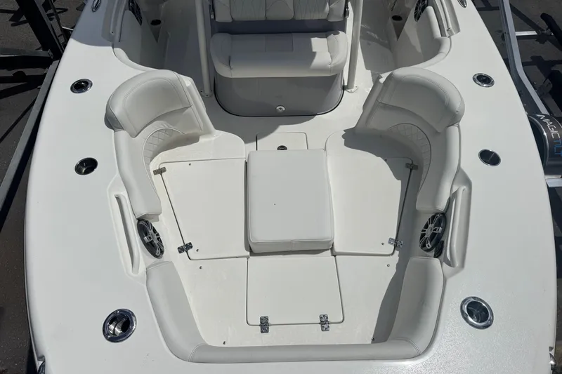  Yacht Photos Pics 2025 Key West 263 FS boat interior with white seating and cup holders.