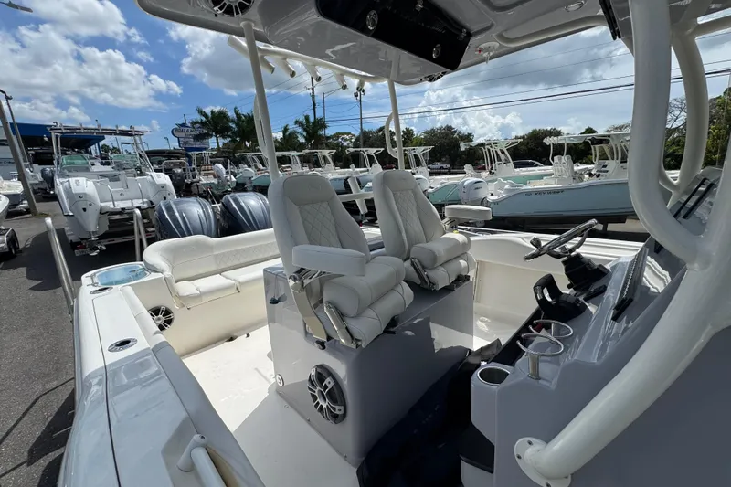  Yacht Photos Pics 2025 Key West 263 FS boat interior with dual seats and steering console.