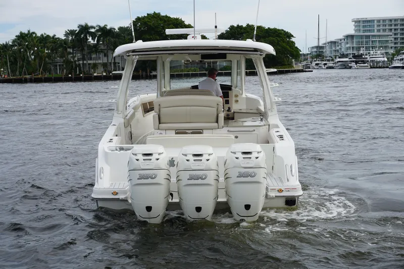 Iboat 3 Yacht Photos Pics 2019 Boston Whaler 350 Realm boat with triple engines on the water.
