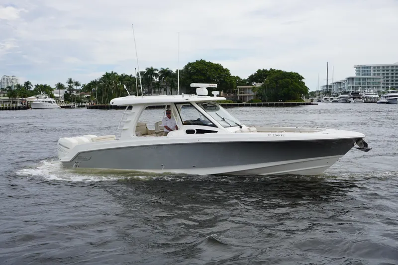 Iboat 3 Yacht Photos Pics 2019 Boston Whaler 350 Realm cruising on a scenic waterway.