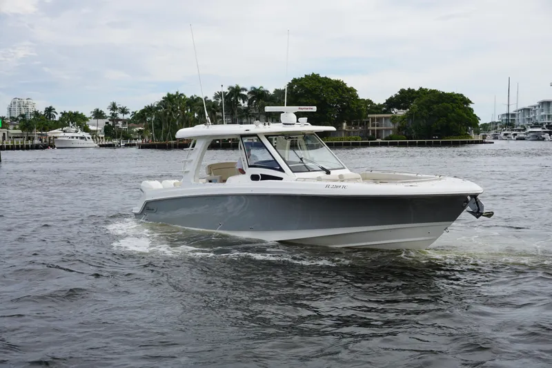 Iboat 3 Yacht Photos Pics 2019 Boston Whaler 350 Realm cruising on a calm waterway.