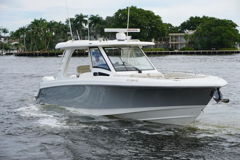 Iboat 3 Yacht Photos Pics 2019 Boston Whaler 350 Realm cruising on a scenic waterway.