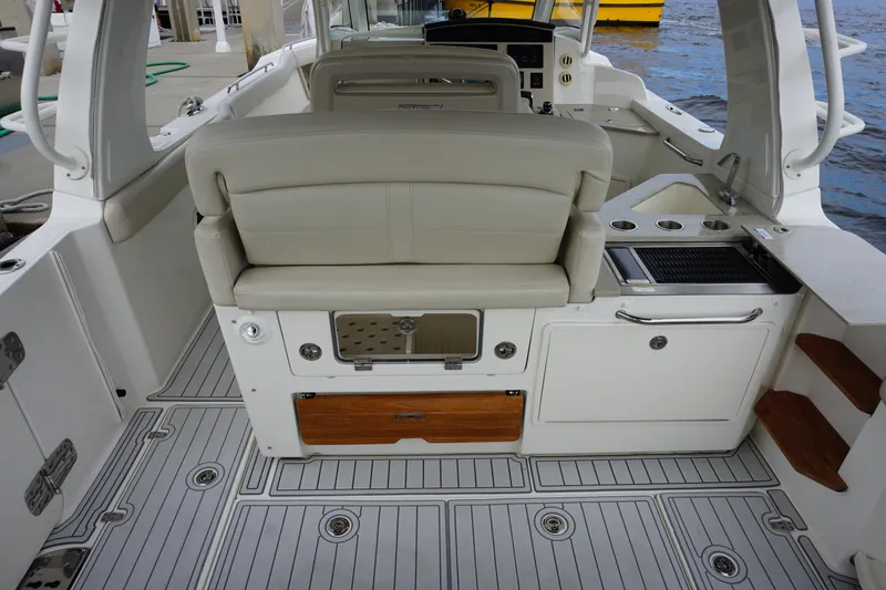 Iboat 3 Yacht Photos Pics 2019 Boston Whaler 350 Realm interior with seating and storage compartments.