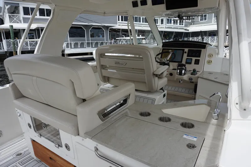 Iboat 3 Yacht Photos Pics Interior of 2019 Boston Whaler 350 Realm boat with luxurious seating and helm.