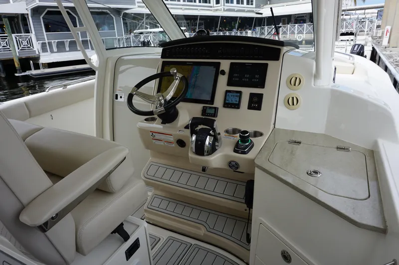 Iboat 3 Yacht Photos Pics 2019 Boston Whaler 350 Realm helm with modern controls and navigation system.
