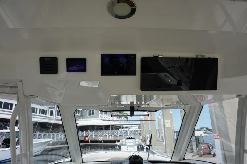 Iboat 3 Yacht Photos Pics 2019 Boston Whaler 350 Realm helm with navigation screens and controls.