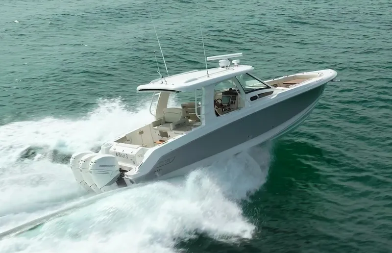 Iboat 3 Yacht Photos Pics 2019 Boston Whaler 350 Realm cruising on open water.