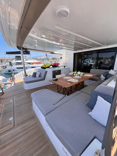 Esperance Yacht Photos Pics 2024 Lagoon 55 yacht with spacious outdoor seating and elegant dining area.