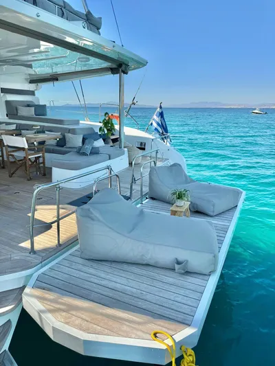 Esperance Yacht Photos Pics Luxury Lagoon 55 yacht, 2024 model, with sun loungers on turquoise water.