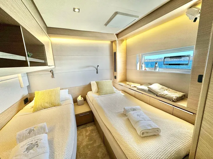 Esperance Yacht Photos Pics Luxurious 2024 Lagoon 55 yacht cabin with twin beds and modern interior design.