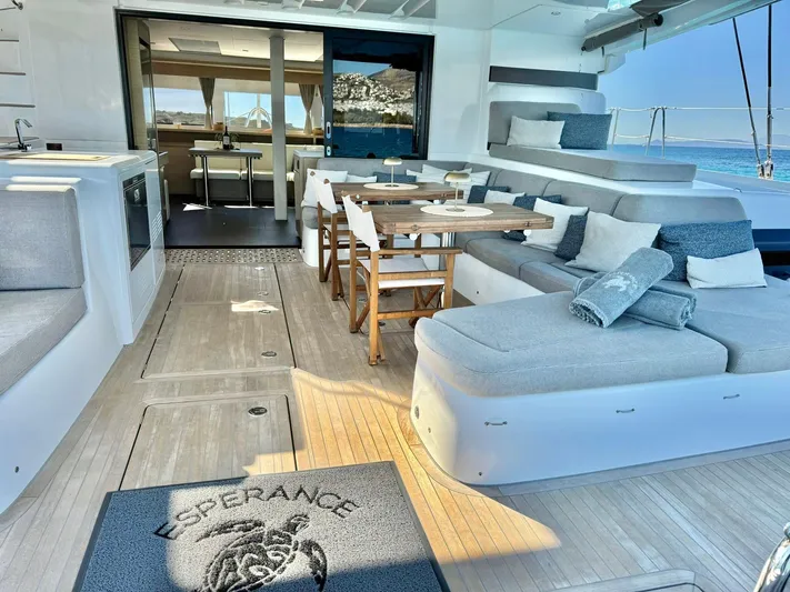 Esperance Yacht Photos Pics Luxurious 2024 Lagoon 55 yacht interior with elegant seating and dining area.