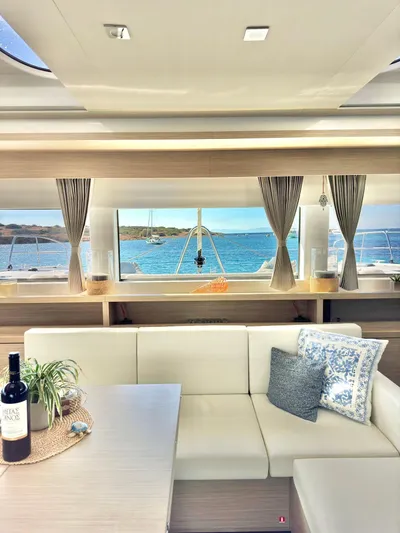 Esperance Yacht Photos Pics Luxurious interior of 2024 Lagoon 55 yacht with ocean view and elegant decor.