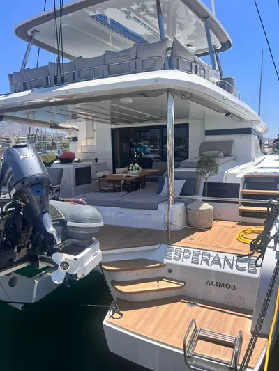 Esperance Yacht Photos Pics 2024 Lagoon 55 yacht with spacious deck and modern design in marina.