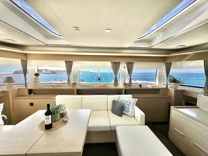 Esperance Yacht Photos Pics Luxurious interior of 2024 Lagoon 55 yacht with ocean view and elegant furnishings.