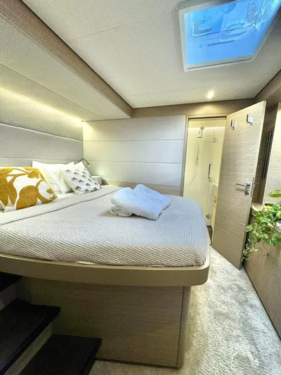 Esperance Yacht Photos Pics Luxurious bedroom interior of 2024 Lagoon 55 yacht with skylight and modern decor.