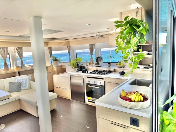 Esperance Yacht Photos Pics Luxurious interior of 2024 Lagoon 55 yacht with modern kitchen and ocean view.