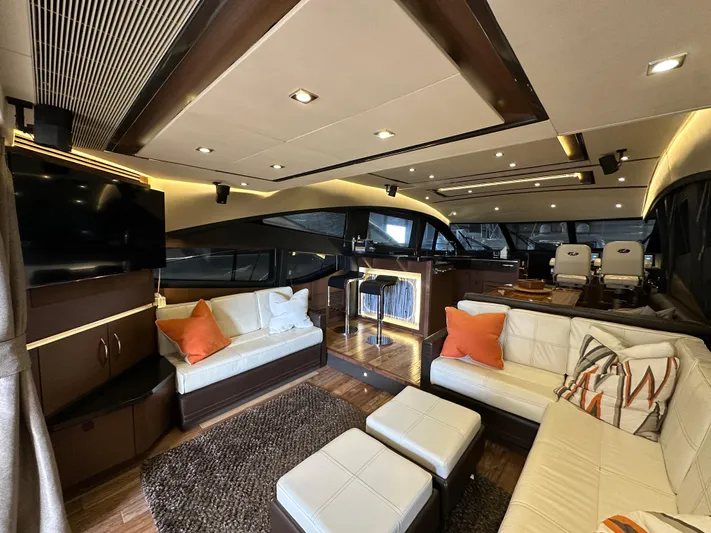Flawless Yacht Photos Pics Luxurious interior of 2015 Sea Ray L650 Fly yacht with modern furnishings and ambient lighting.