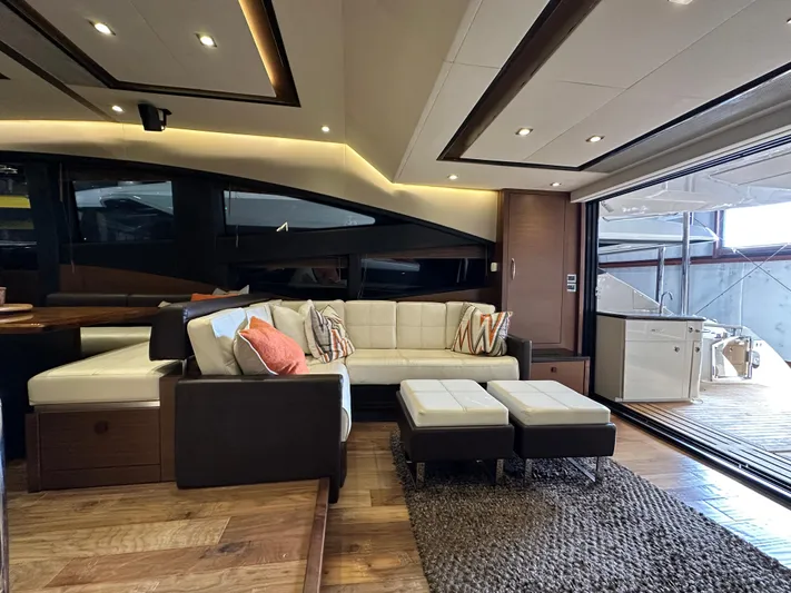 Flawless Yacht Photos Pics Luxurious interior of 2015 Sea Ray L650 Fly yacht with modern seating and elegant design.