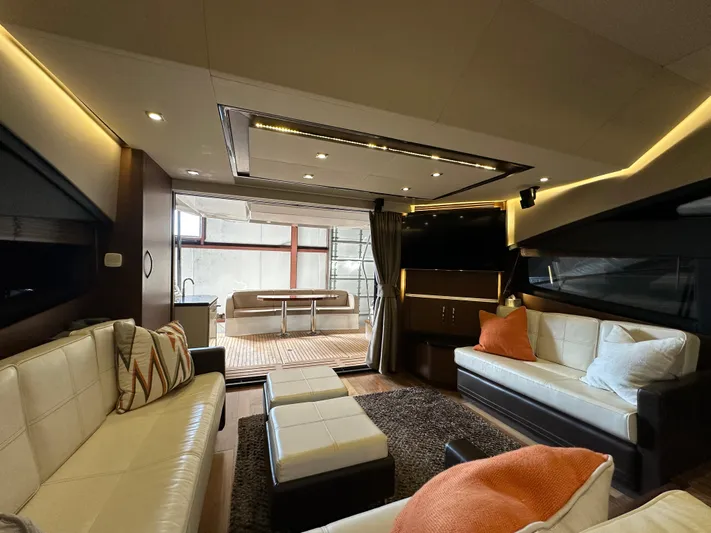 Flawless Yacht Photos Pics Luxurious interior of 2015 Sea Ray L650 Fly yacht with modern seating and elegant decor.