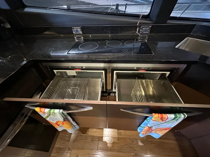 Flawless Yacht Photos Pics Modern kitchen in 2015 Sea Ray L650 Fly yacht with sleek appliances and storage.