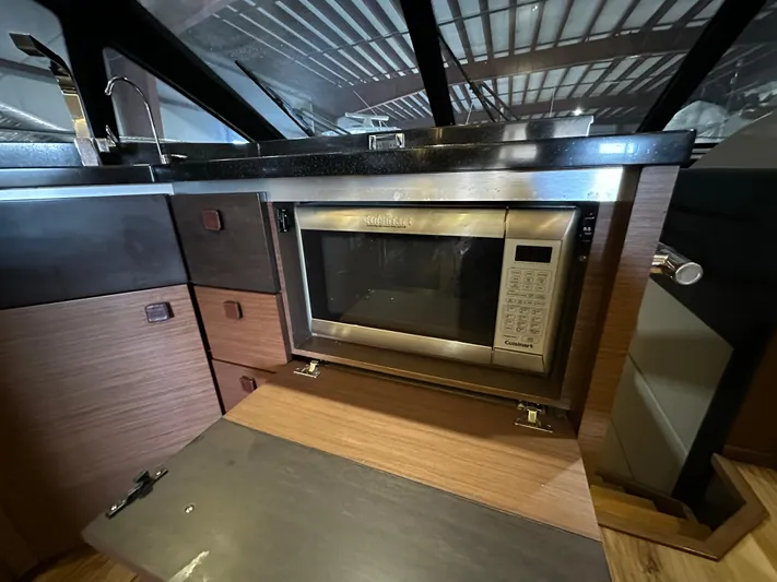 Flawless Yacht Photos Pics Modern kitchen with built-in microwave on 2015 Sea Ray L650 Fly yacht.