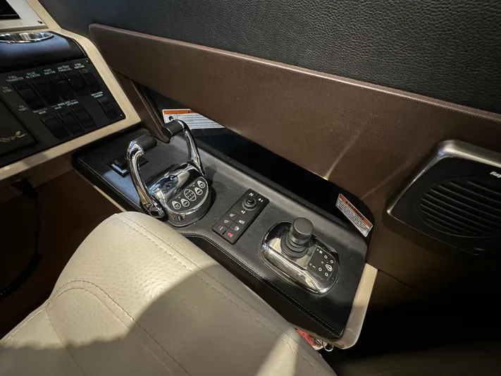 Flawless Yacht Photos Pics Control panel of a 2015 Sea Ray L650 Fly yacht, featuring modern navigation equipment.