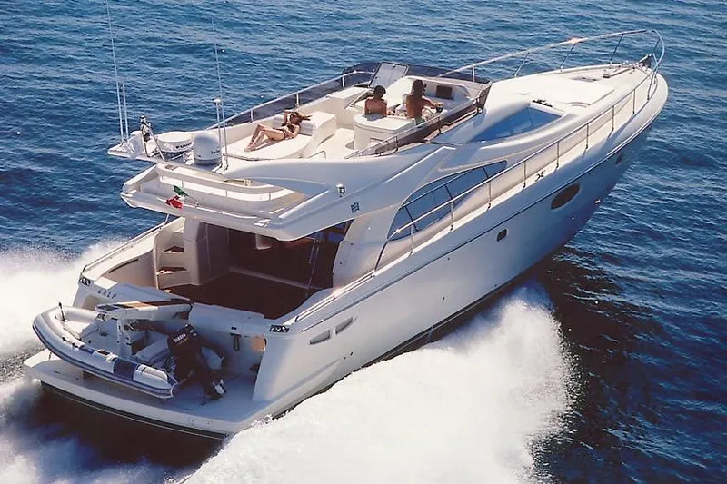  Yacht Photos Pics 2004 Ferretti Yachts 590 cruising on open water, showcasing luxury and elegance.