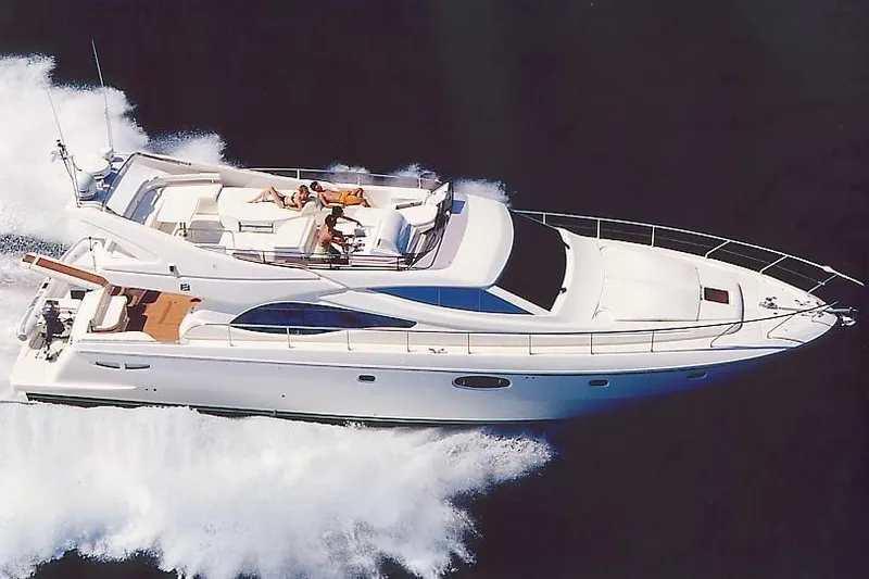  Yacht Photos Pics 2004 Ferretti Yachts 590 cruising on open water, aerial view.
