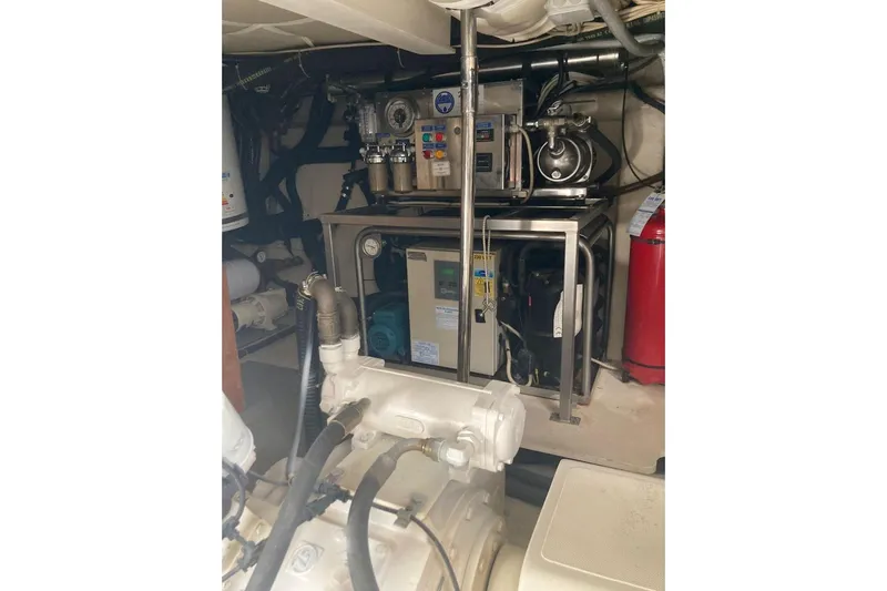  Yacht Photos Pics Engine room of 2004 Ferretti Yachts 590, showcasing mechanical equipment and systems.