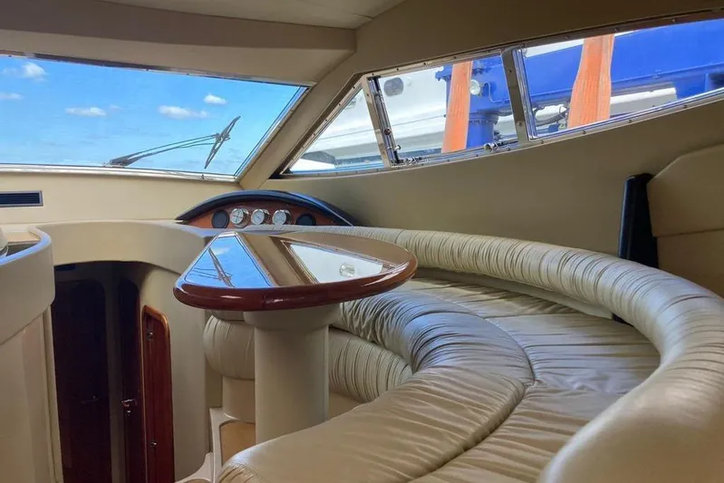  Yacht Photos Pics Luxurious interior of 2004 Ferretti Yachts 590 with plush seating and panoramic windows.