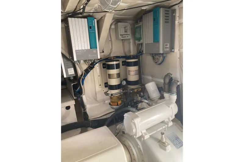  Yacht Photos Pics Engine room of 2004 Ferretti Yachts 590, showcasing mechanical components and systems.