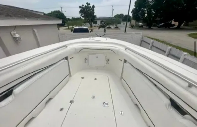  Yacht Photos Pics 2006 Wellcraft 32 CCF boat interior, featuring spacious seating and storage compartments.