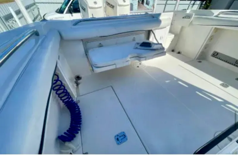  Yacht Photos Pics 2006 Wellcraft 32 CCF boat interior with seating and storage compartments.