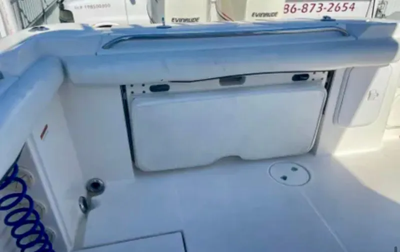  Yacht Photos Pics 2006 Wellcraft 32 CCF boat interior with storage compartment and clean deck.