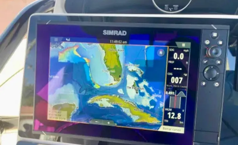 Yacht Photos Pics Simrad navigation display on 2006 Wellcraft 32 CCF boat, showing nautical map and data.