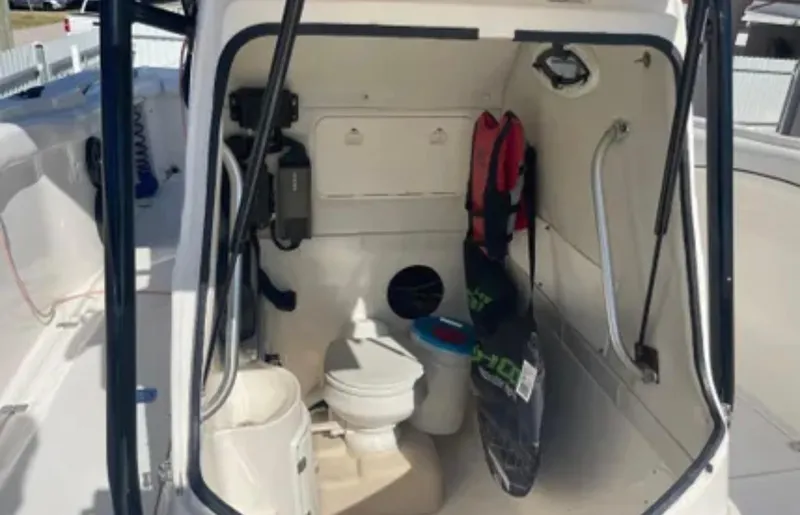  Yacht Photos Pics Interior of a 2006 Wellcraft 32 CCF boat showing a compact bathroom area.
