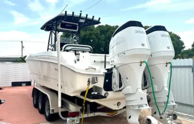  Yacht Photos Pics 2006 Wellcraft 32 CCF boat on trailer with dual outboard engines.