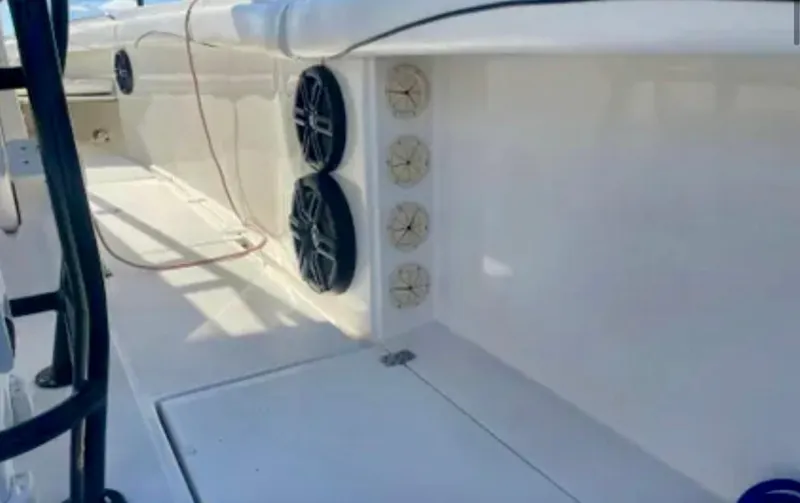  Yacht Photos Pics 2006 Wellcraft 32 CCF boat interior with speakers and storage compartments.