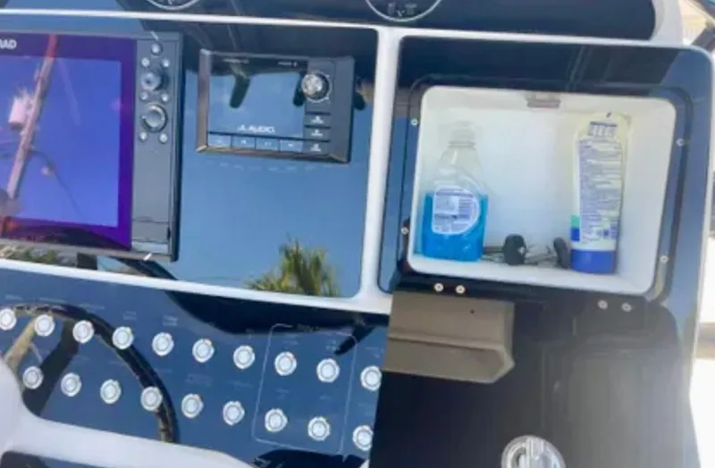  Yacht Photos Pics Control panel of 2006 Wellcraft 32 CCF boat with navigation and storage compartments.