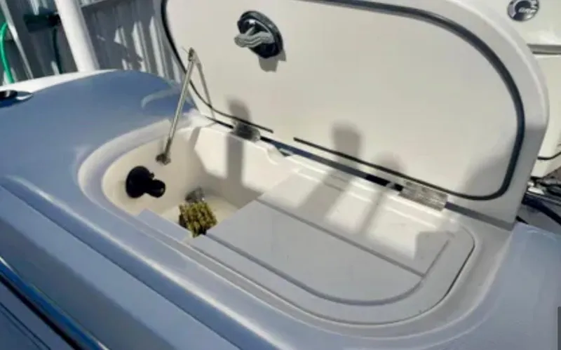  Yacht Photos Pics Open storage compartment on 2006 Wellcraft 32 CCF boat, showing interior details.