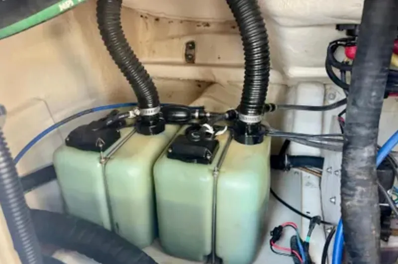  Yacht Photos Pics 2006 Wellcraft 32 CCF engine compartment with dual fuel tanks and hoses.