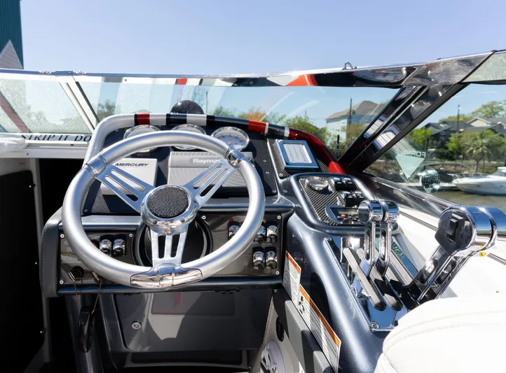  Yacht Photos Pics 2017 Formula 382 FASTech boat cockpit with steering wheel and control panel.