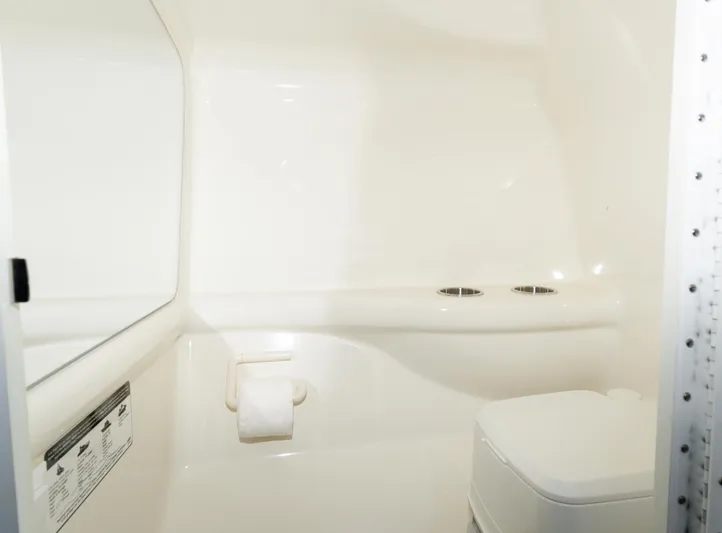  Yacht Photos Pics 2017 Formula 382 FASTech boat bathroom interior with toilet and mirror.