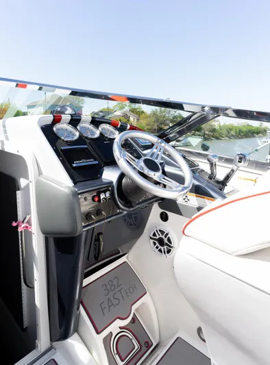  Yacht Photos Pics 2017 Formula 382 FASTech boat cockpit with steering wheel and control panel.